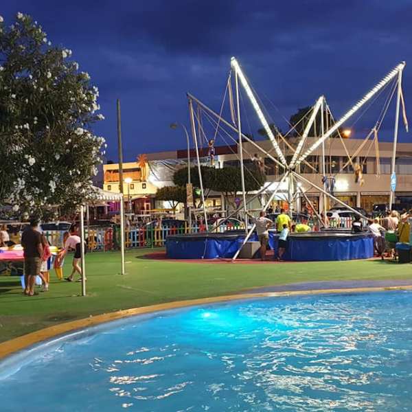 a group of people in a pool of water