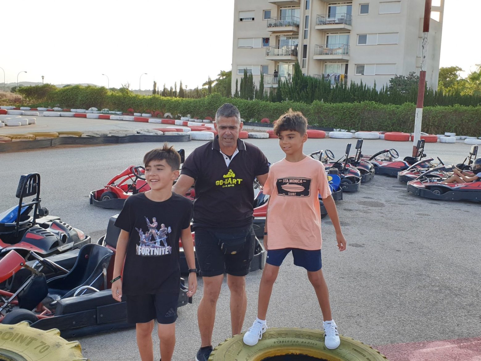 a group of people standing in a parking lot