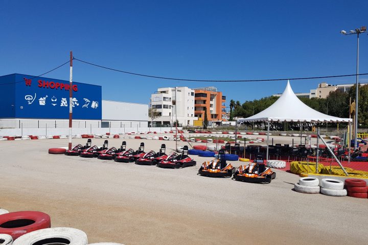 a group of people sitting in a parking lot